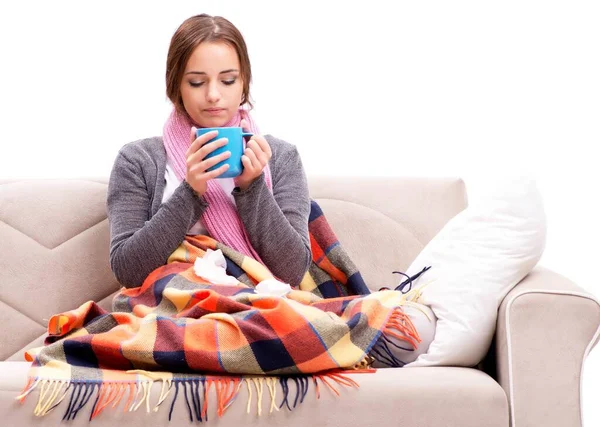 Teenager suffering from cold sitting on coach — Stock Photo, Image