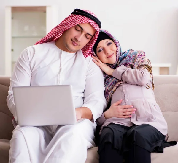 Young arab muslim family with pregnant wife expecting baby — Stock Photo, Image