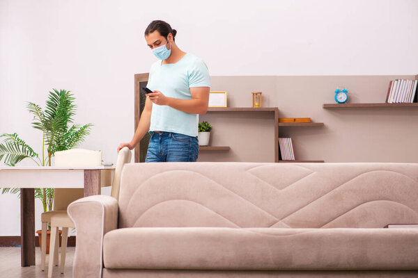 Young man boring at home during pandemic