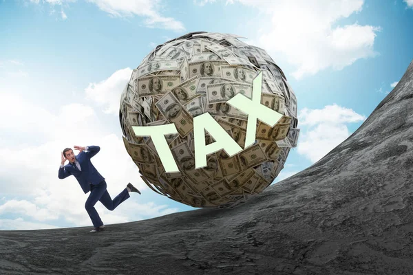 Businessman running away in tax concept — Stock Photo, Image