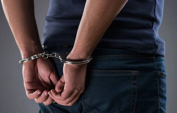 Man with his hands handcuffed in criminal concept — Stock Photo, Image