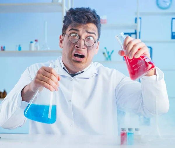 Funny mad chemist working in a laboratory — Stock Photo, Image