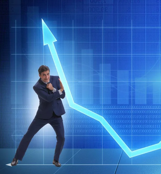 Businessman trying to help economic growth in business concept — Stock Photo, Image