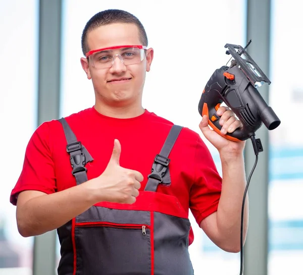 Young furniture carpenter in industrial concept — Stock Photo, Image