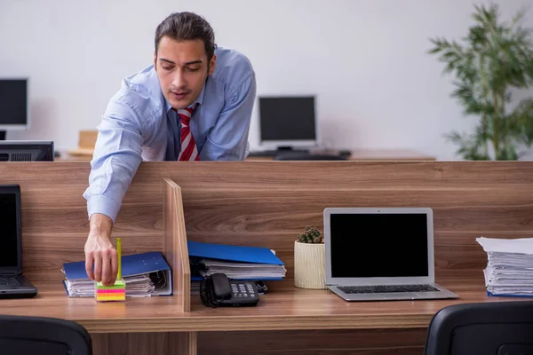 Young male employee in industrial espionage concept — Stock Photo, Image