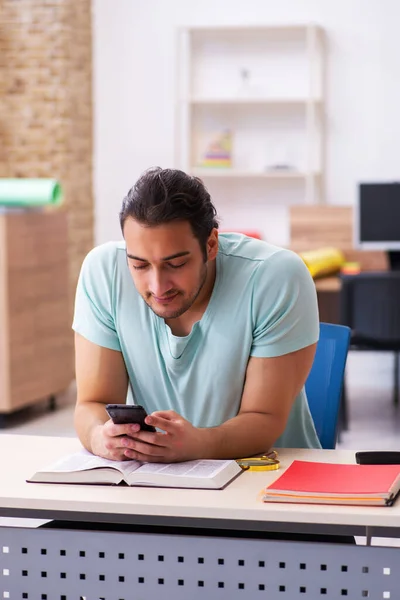 Young male student preparing for exam at home — Stock Photo, Image