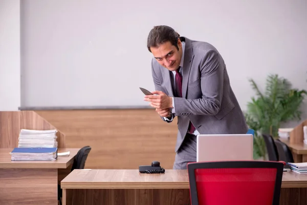 Young businessman employee in bullying concept in the office — Stock Photo, Image