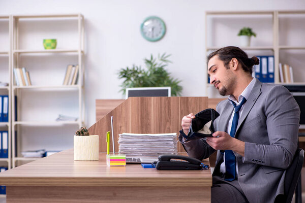 Young male employee working in the office