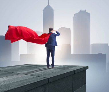 Süper kahraman iş adamı binanın tepesinde meydan okumaya hazır.