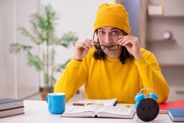 Young male student preparing for exams at home — Stock Photo, Image