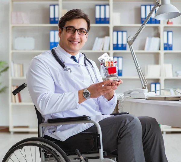 Disabled doctor on wheelchair working in hospital