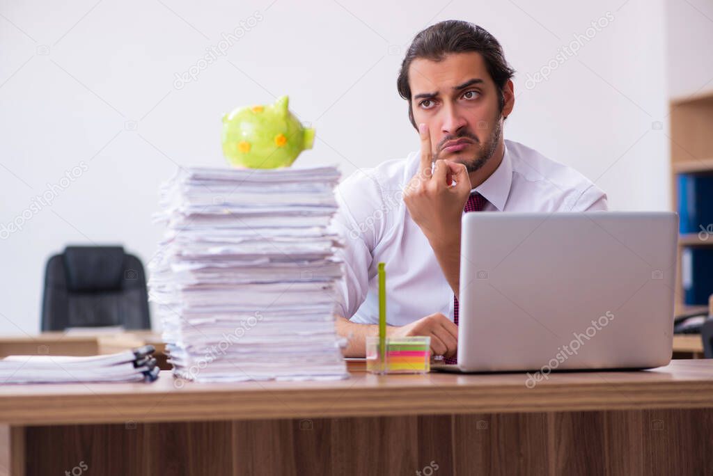 Young male employee in retirement concept in the office