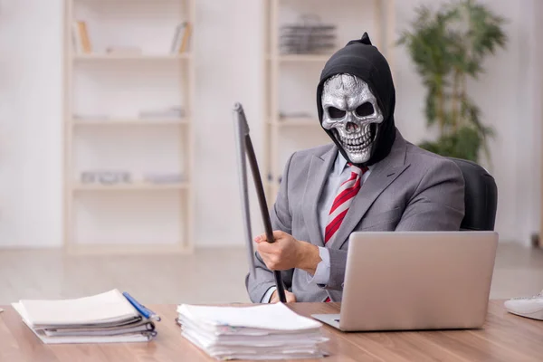 Devil businessman employee sitting at workplace — Stock Photo, Image