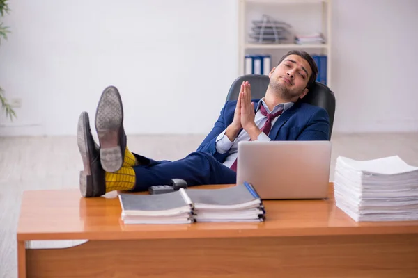 Young businessman and too much work in the office — Stock Photo, Image