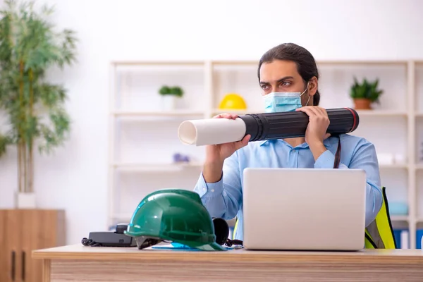 Young male architect working in the office during pandemic — Stock Photo, Image