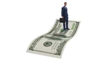 İş adamı 100 dolarlık banknotla uçuyor.