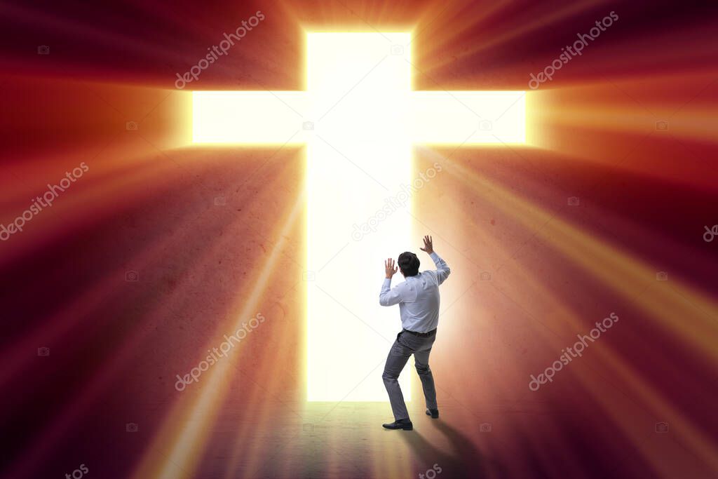 Religious concept with cross and lonely man
