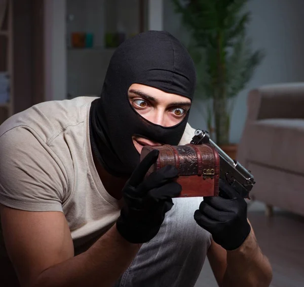 Burglar wearing balaclava mask at crime scene — Stock Photo, Image