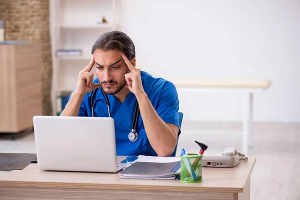 Young male doctor in telemedicine concept — Stock Photo, Image