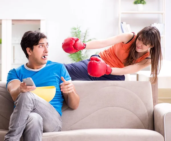 Wife unhappy that husband is watching boxing — Stock Photo, Image