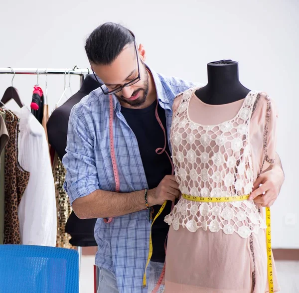 Male tailor working in the workshop on new designs — Stock Photo, Image