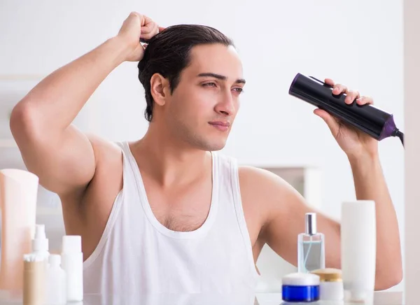 Young man drygin his hair in the morning — Stock Photo, Image