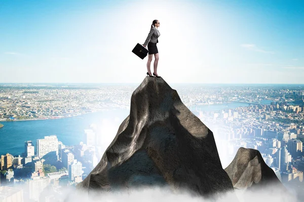 Businesswoman at the top of mountain in career concept — Stock Photo, Image