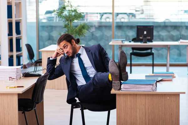 Young male employee working in the office — Stock Photo, Image