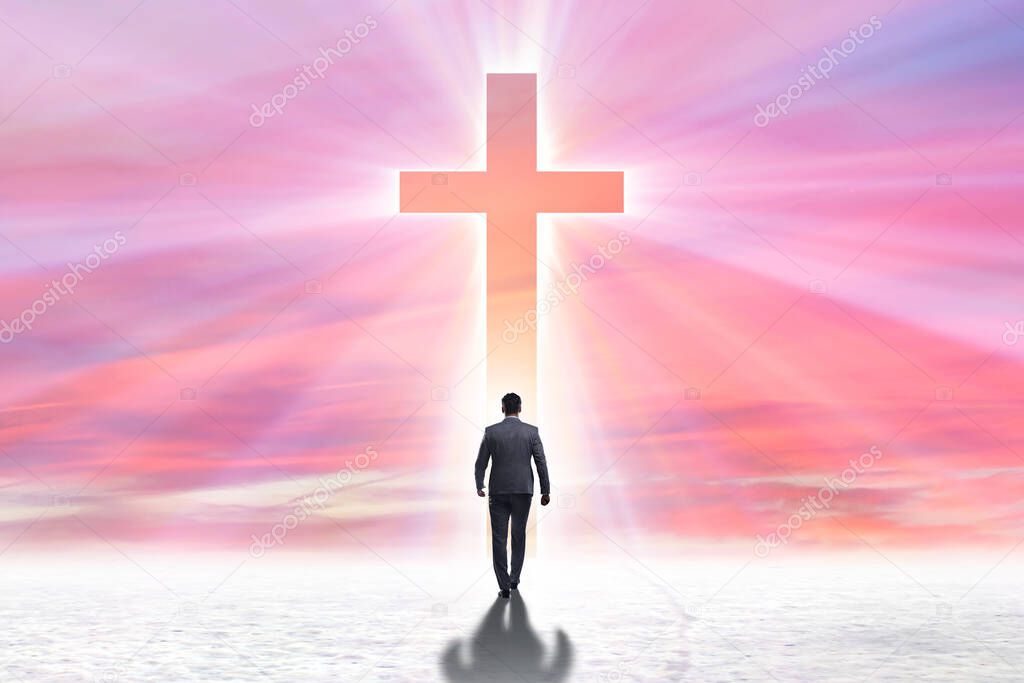 Religious concept with cross and lonely man