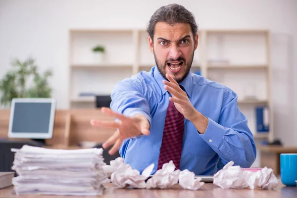 Young male employee in brainstorming concept — Stock Photo, Image