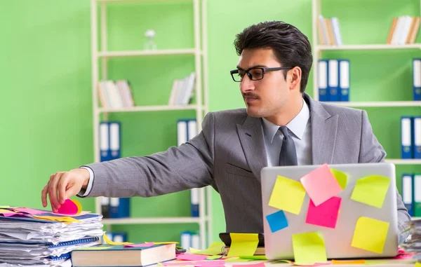 Businessman unhappy with many conflicting priorities sitting in — Stock Photo, Image