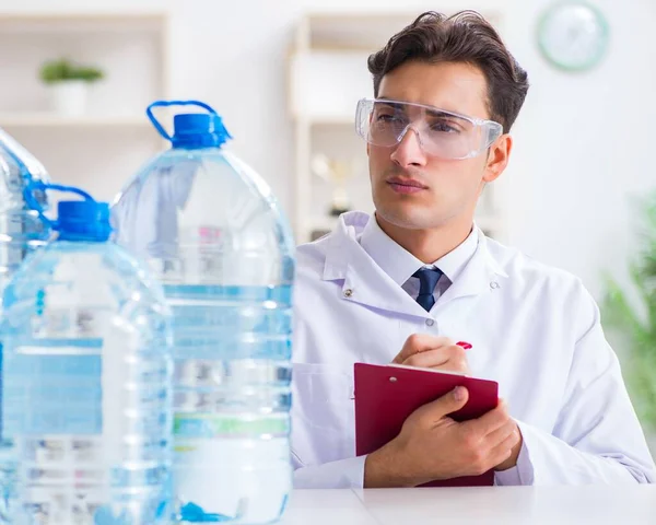 Lab assistant testing water quality