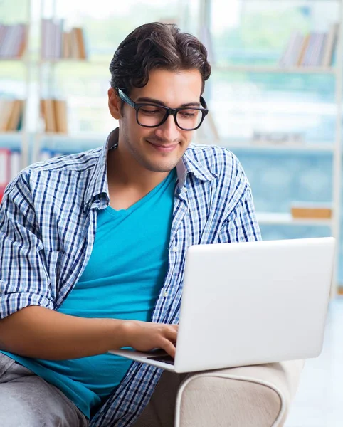 Caucasian student with laptop preparing for university exams — Stock Photo, Image