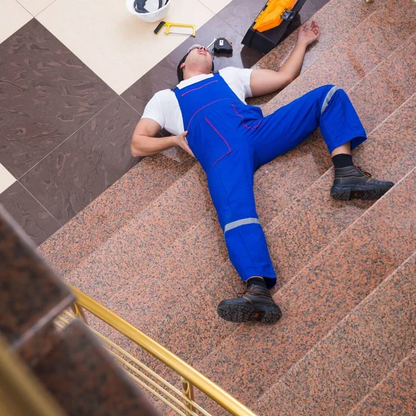 Dead contractor worker felling off the stairs — Stock Photo, Image