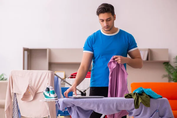 Young man husband doing ironing at home — Stock Photo, Image