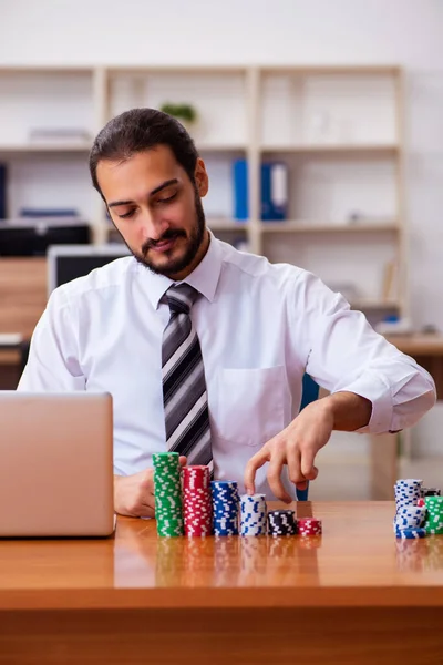 Young male employee in gambling concept — Stock Photo, Image