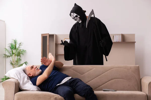 Devil visting old dying man at home — Stock Photo, Image