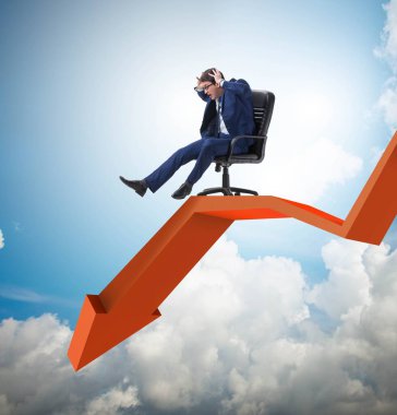 Ekonomik kriz konseptinde işadamı koltuğundan kayıyor