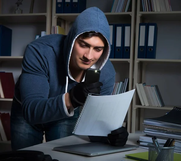 Young man in industrial espionage concept — Stock Photo, Image