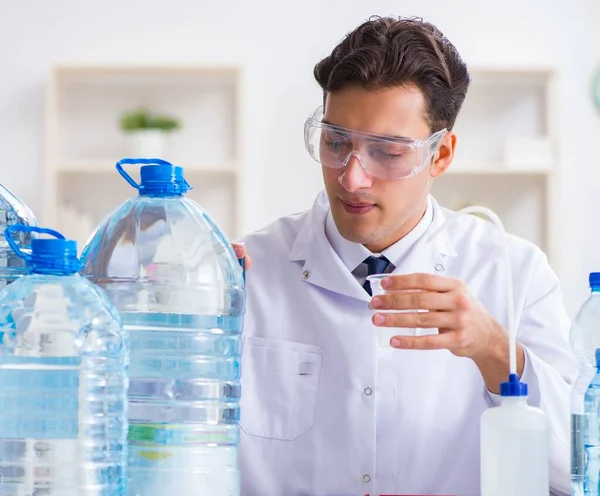 Lab assistant testing water quality