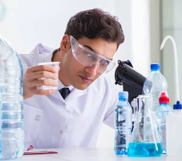 Lab assistant testing water quality