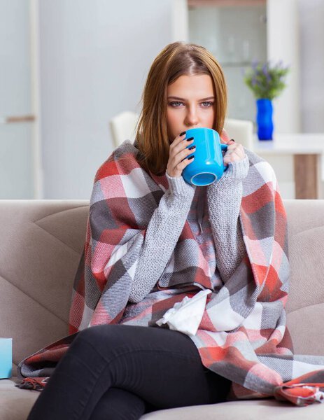 Sick woman suffering from flu at home