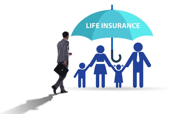 Life insurance concept with family under umbrella — Stock Photo, Image