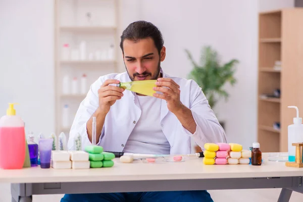 Young male chemist testing soap in the lab — Stock Photo, Image