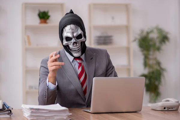 Devil businessman employee sitting at workplace — Stock Photo, Image