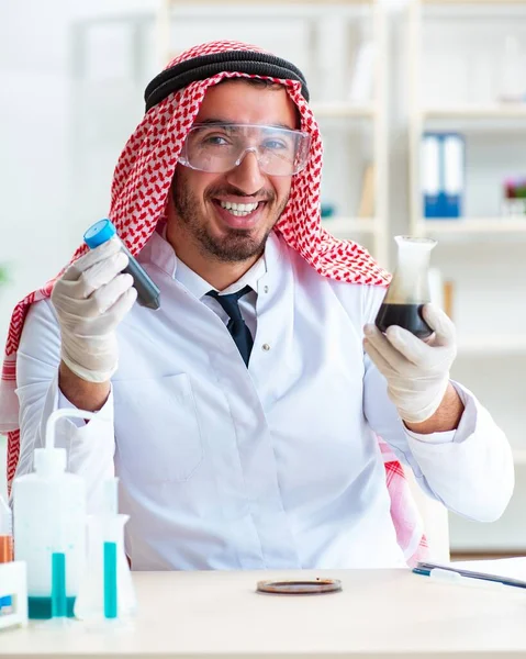 Arab chemist scientist testing quality of oil petrol — Stock Photo, Image