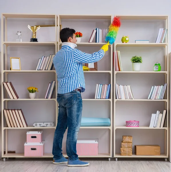 Man with neck unjury cleaning house in housekeeping concept — Stock Photo, Image