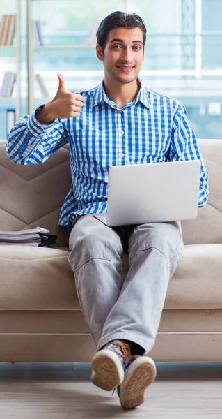 Caucasian student with laptop preparing for university exams — Stock Photo, Image