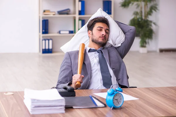 Joven empleado masculino en concepto de sueño excesivo —  Fotos de Stock