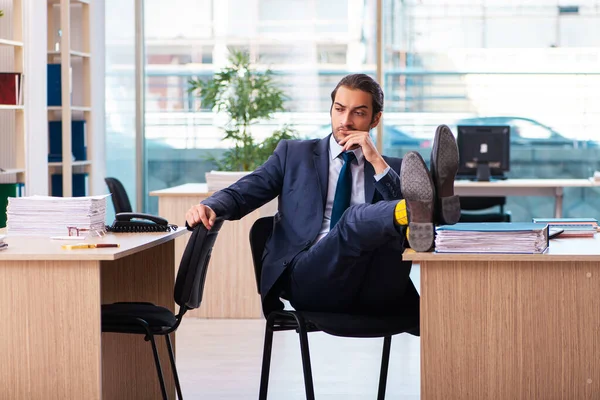 Young male employee working in the office — Stock Photo, Image